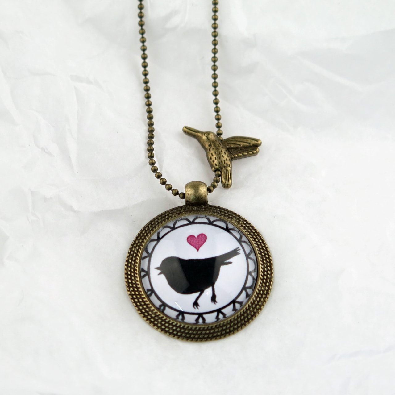 Medaillon-Halskette Herz Vogel