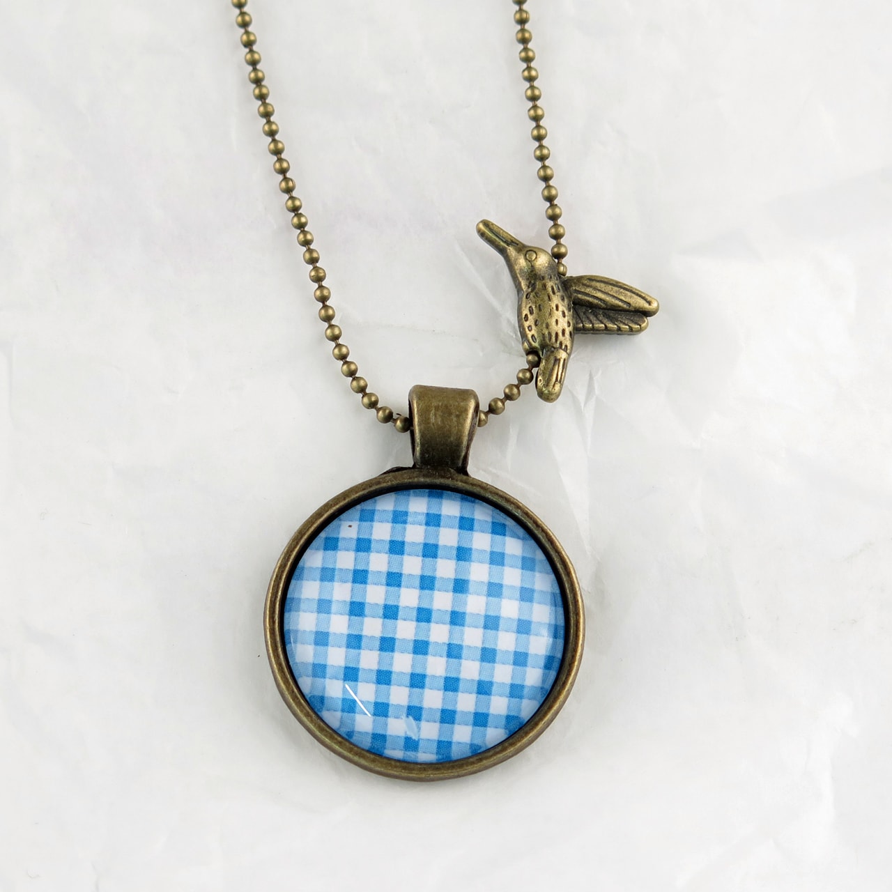Medaillon-Halskette Karo blau-weiss