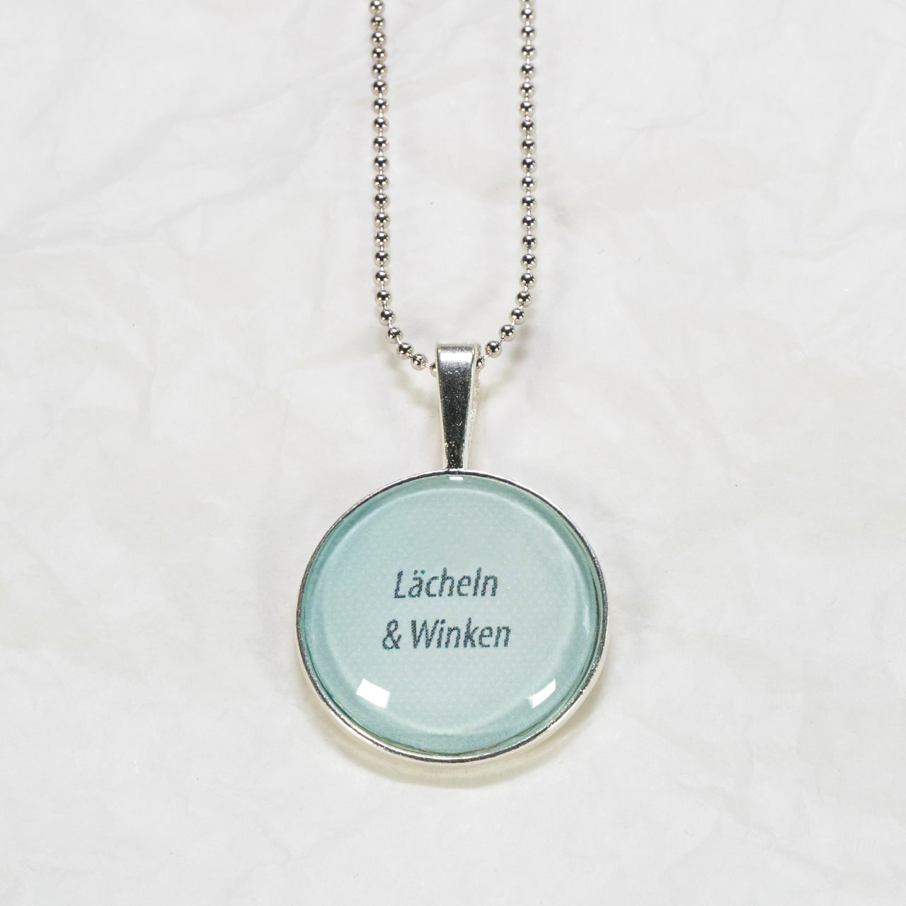 Medaillon-Halskette Lächeln & Winken