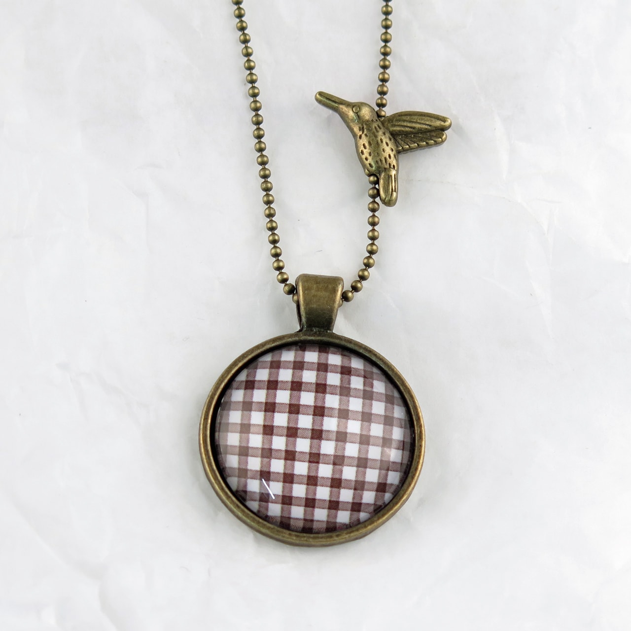 Medaillon-Halskette Karo braun-weiss
